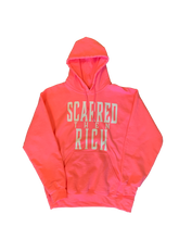 Load image into Gallery viewer, Pink sweatshirt with "Scarred then Rich" written in white
